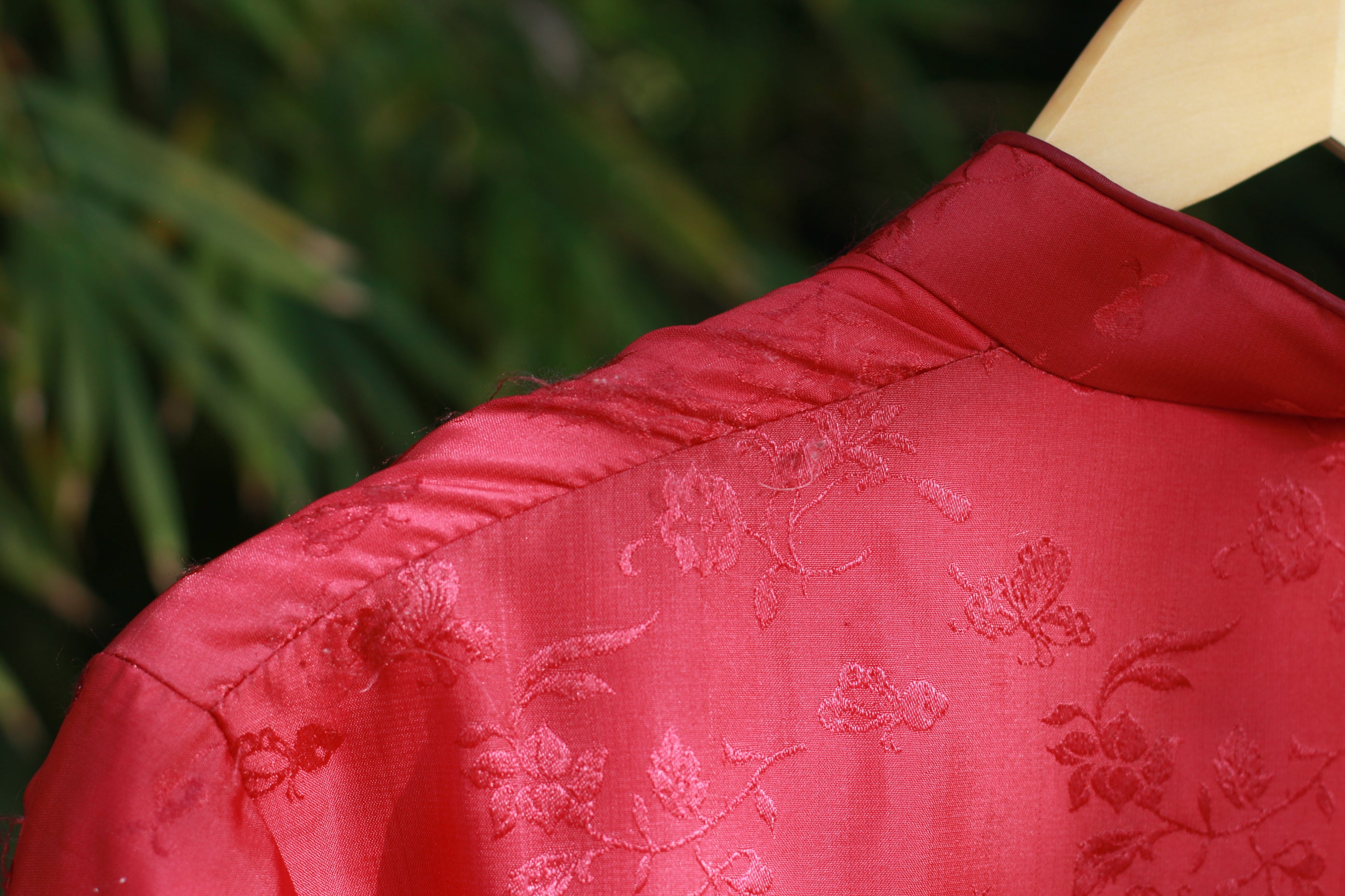 Close-up detail of red floral brocade