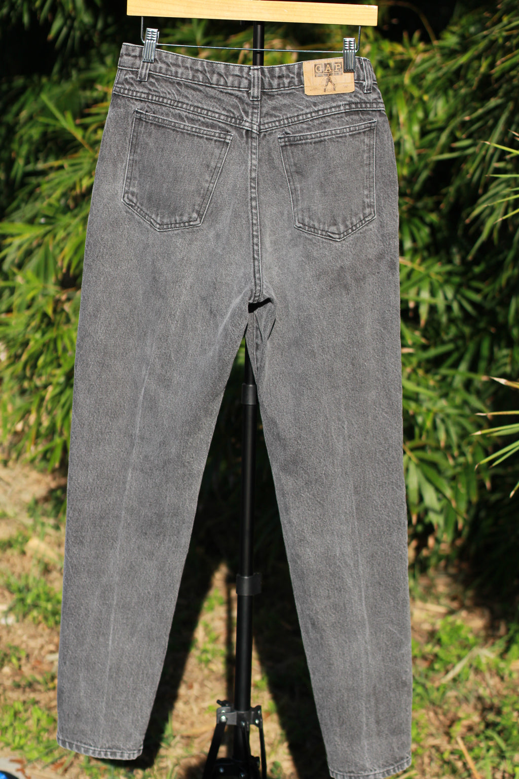 Back view of washed black vintage GAP skinny jeans