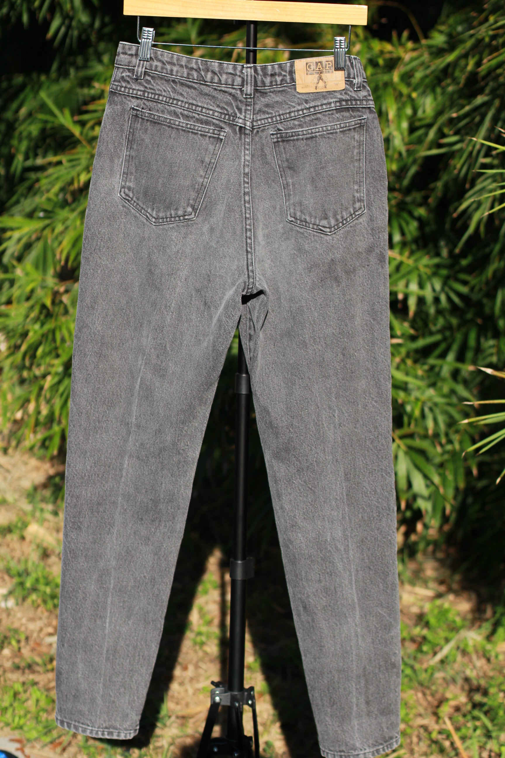 Back view of washed black vintage GAP skinny jeans