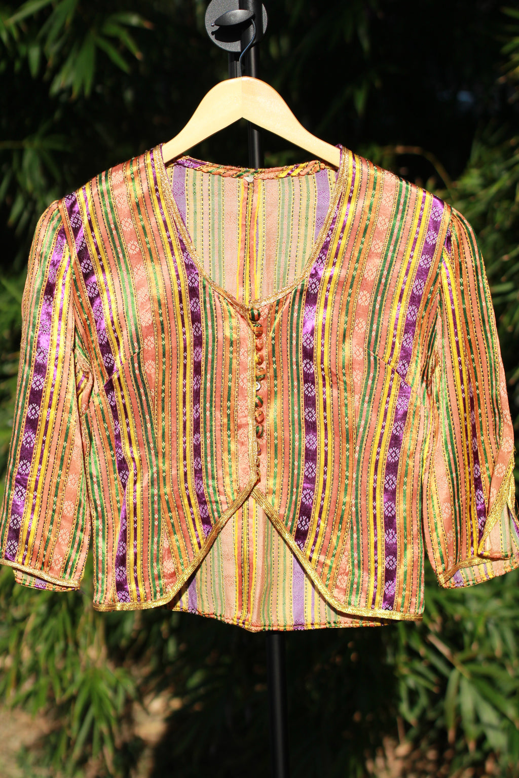Front view of cropped antique ceremonial bolero jacket