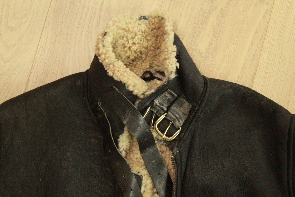 Close-up of neck buckle details on Vintage Black B3 Shearling Bomber Jacket