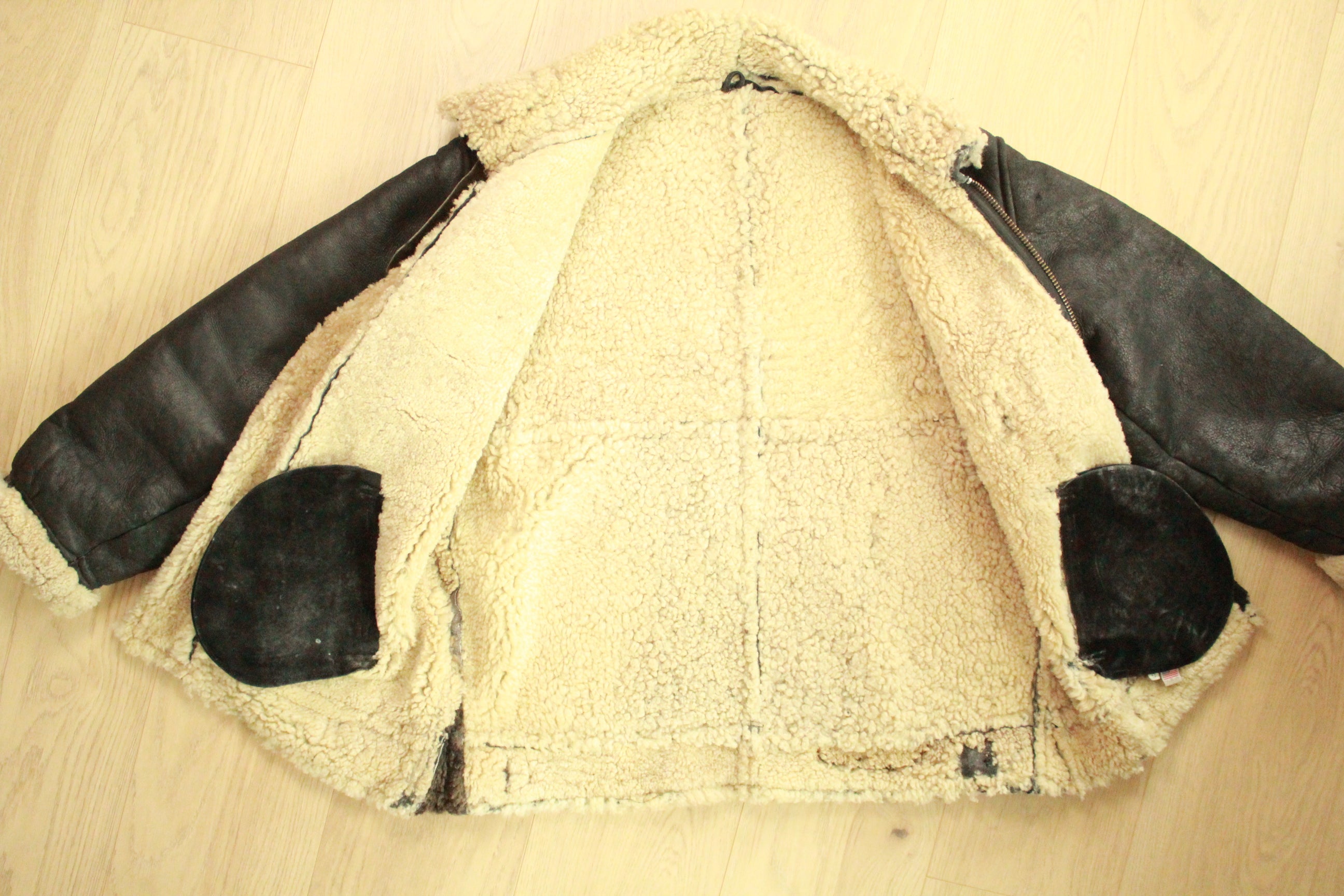 Front view of open Vintage Black B3 Shearling Bomber Jacket - flat lay