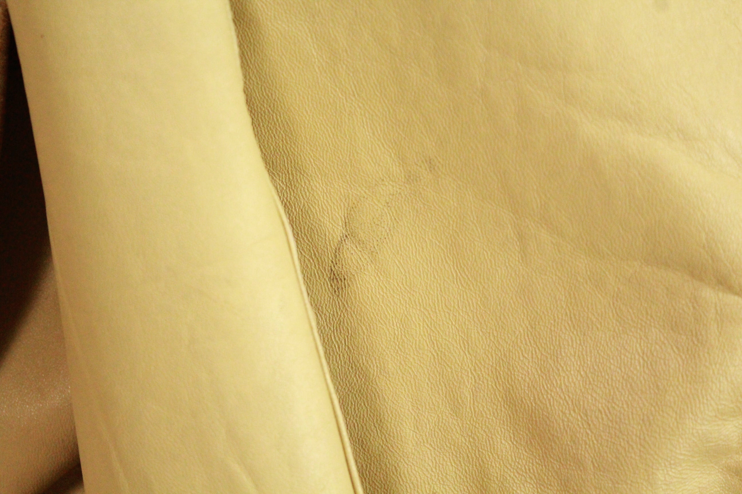 Close-up of mark on Vintage Beige Leather Tie-Belt Jacket