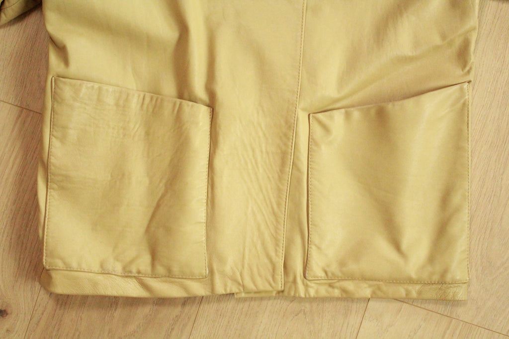 Close-up of front pockets on Vintage Beige Leather Tie-Belt Jacket
