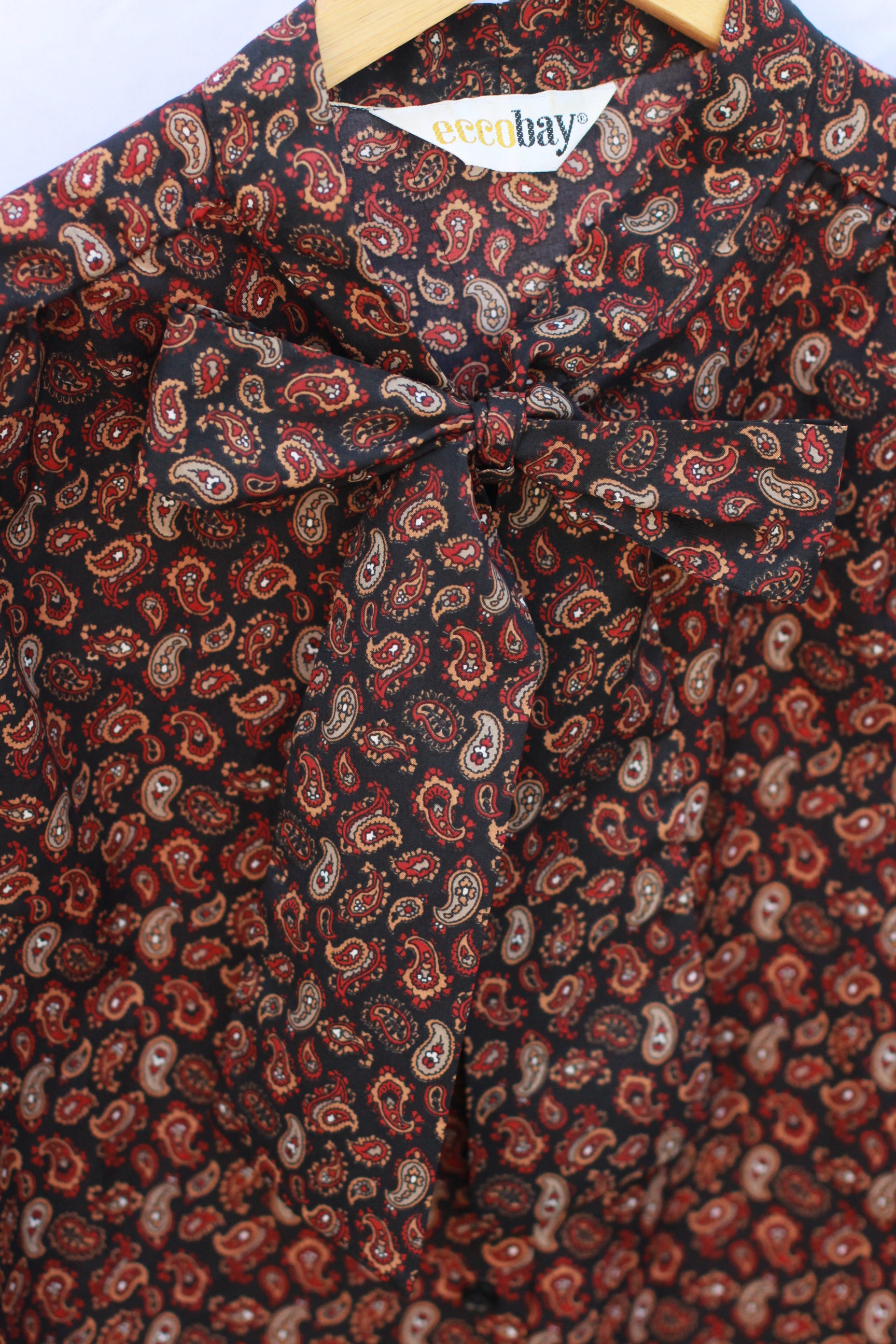 Detail of pussy-bow necktie on vintage paisley blouse
