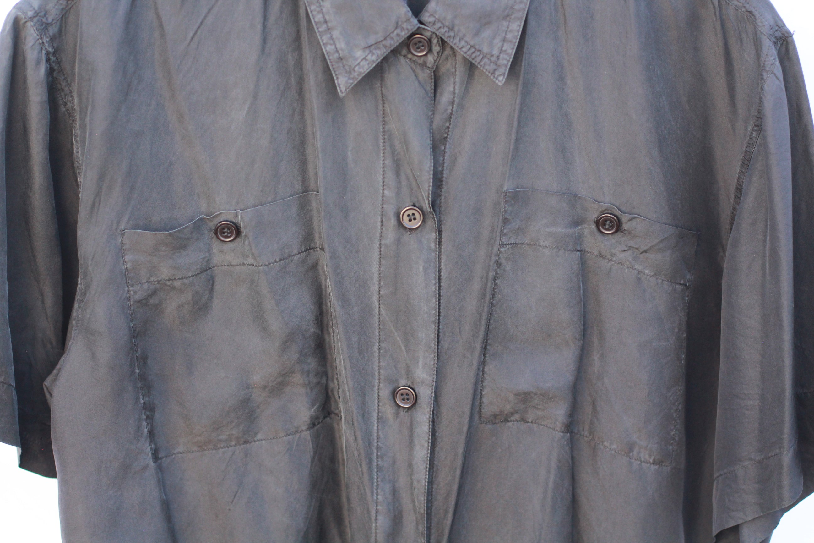 Close-up of chest pockets on vintage silk button-up shirt