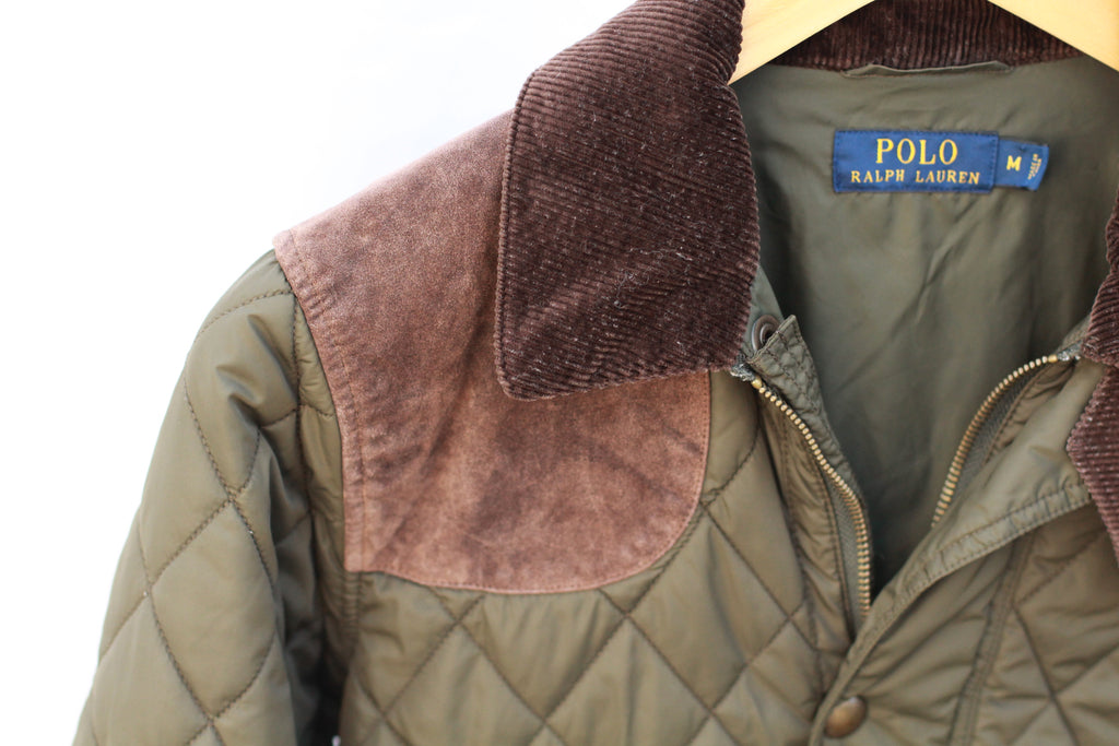 Detail of suede shoulder patch on equestrian jacket