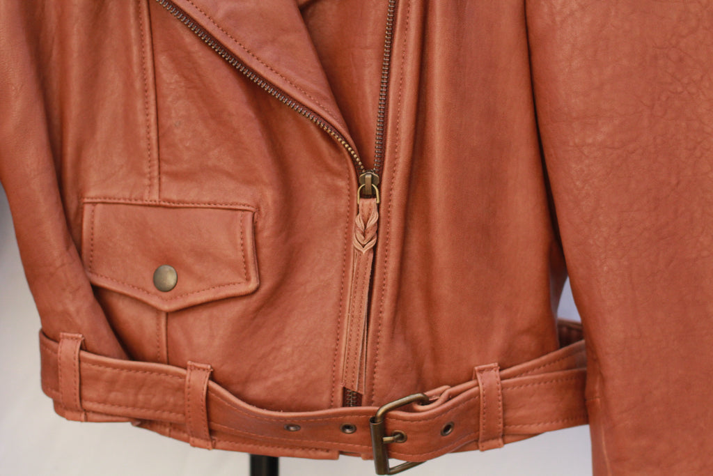 Detail of belt on leather biker jacket