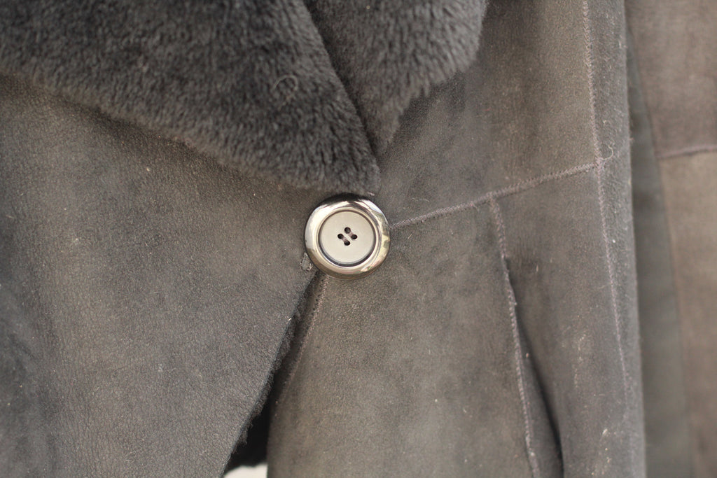 Detail of single waist button and plush interior lining