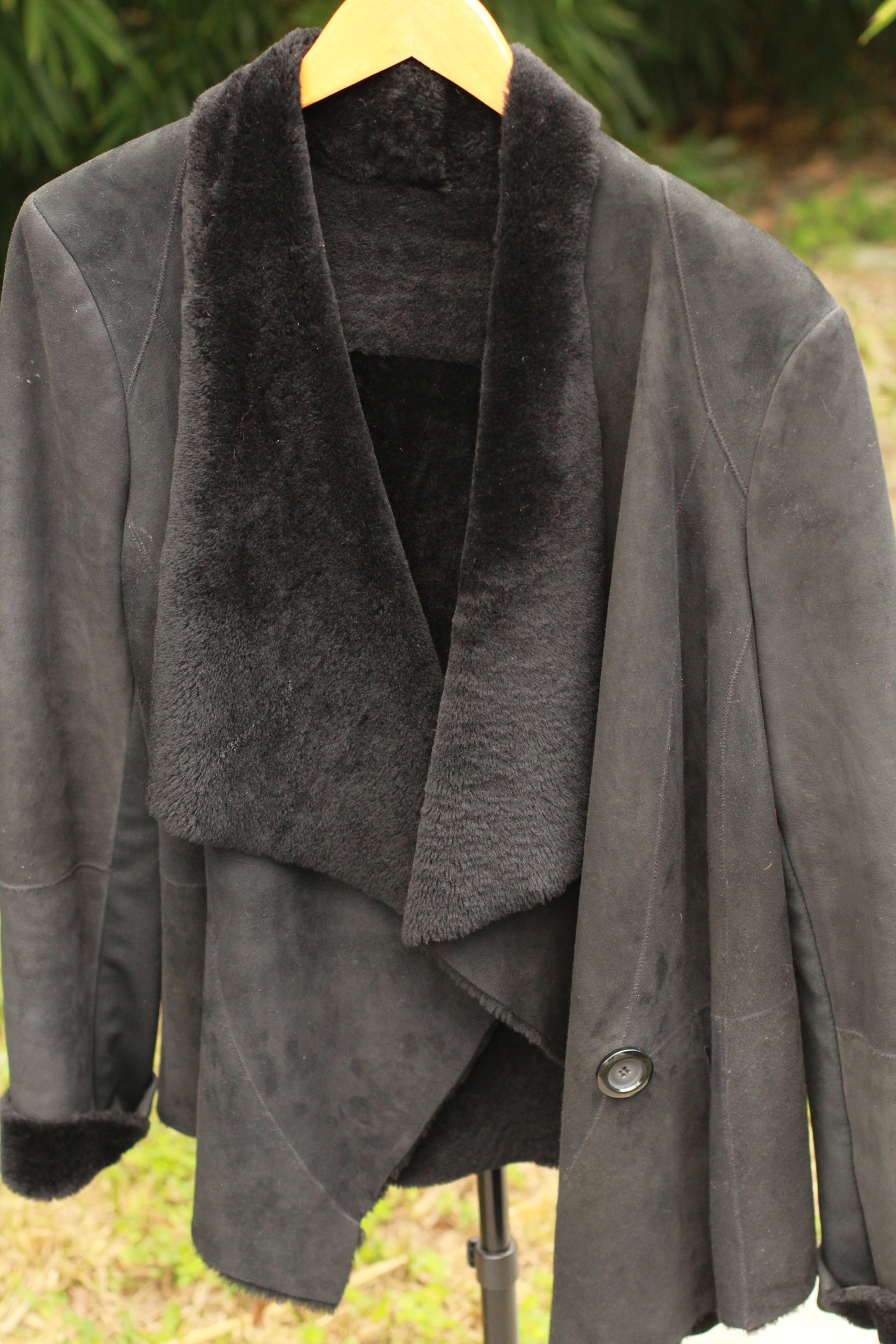 Black double-faced shearling coat with single waist button front view by Blue Duck