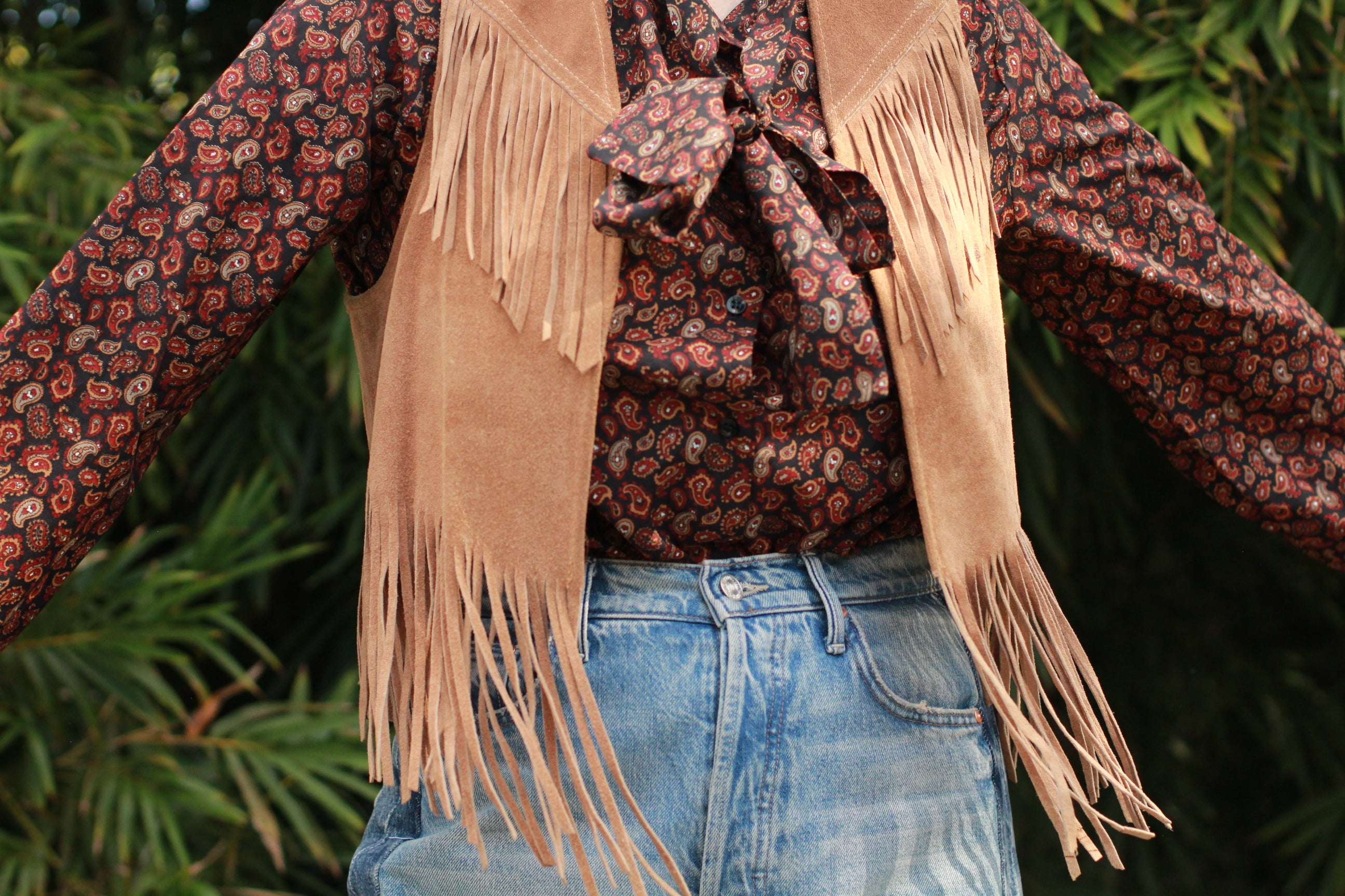 Detail of pussy-bow necktie on vintage paisley blouse