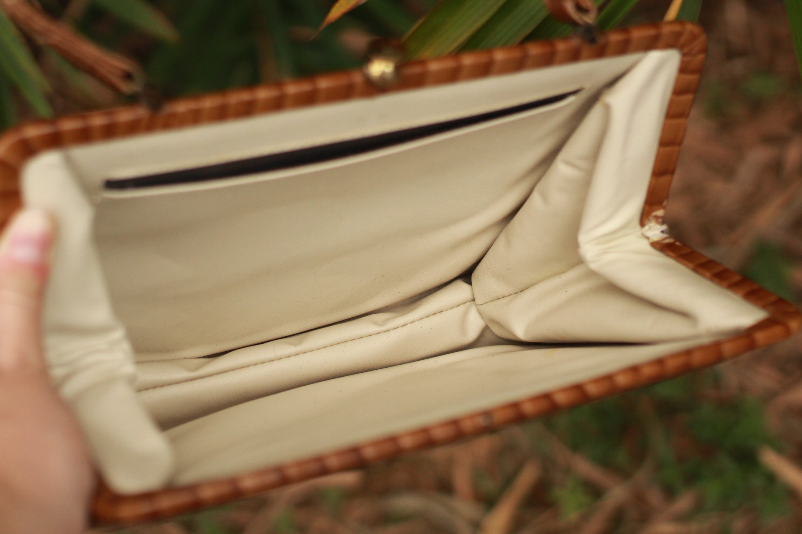 Soft cream interior with inside pocket of vintage leather bag