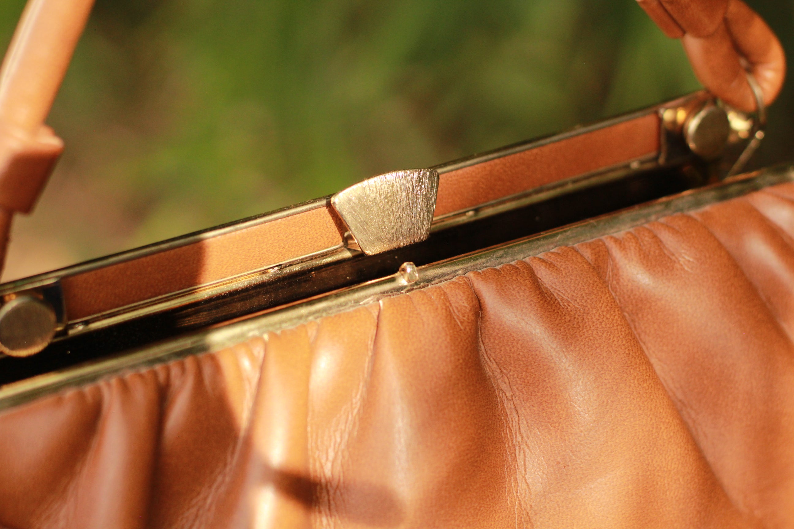 Close-up of gold-tone clasp and hardware