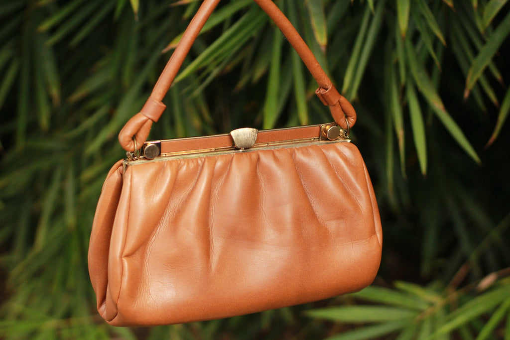 Vintage cognac top-handle handbag with gold clasp, front view