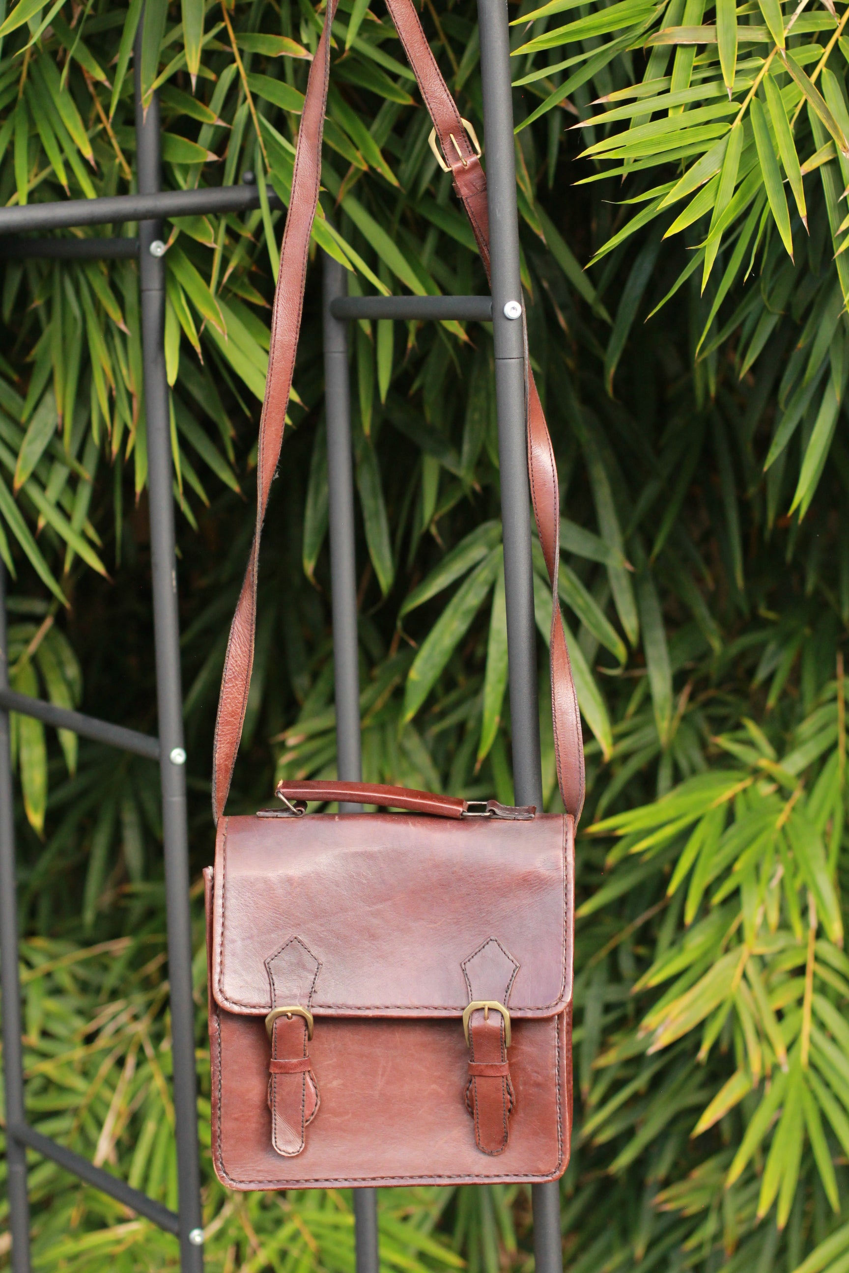 Crossbody strap view of Gammon Shire handmade leather messenger bag