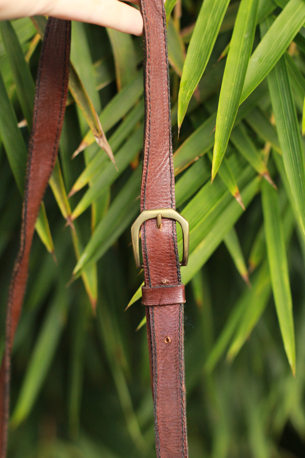 Adjustable crossbody strap on handmade leather bag