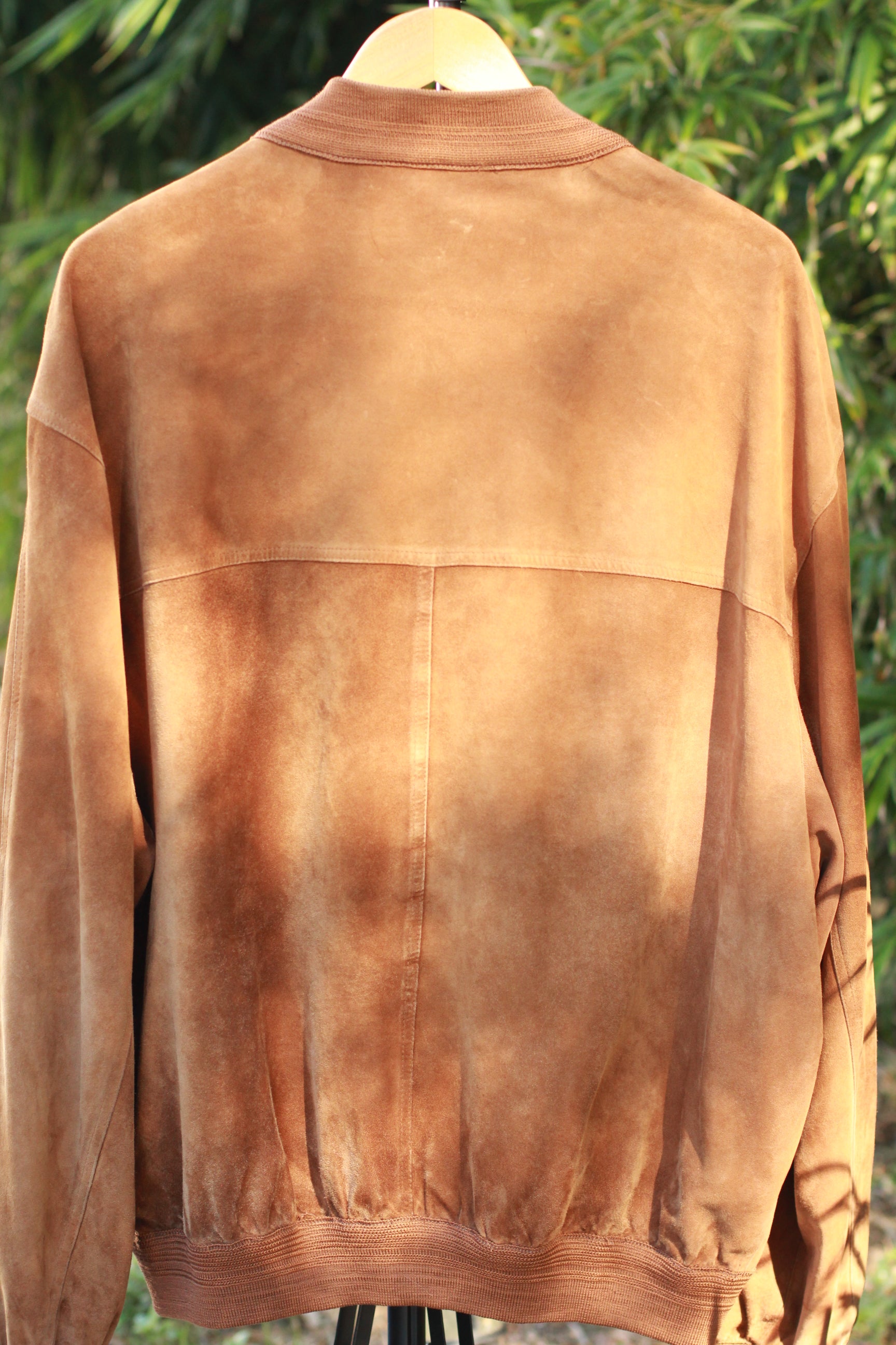Back view of vintage 1980s suede bomber jacket
