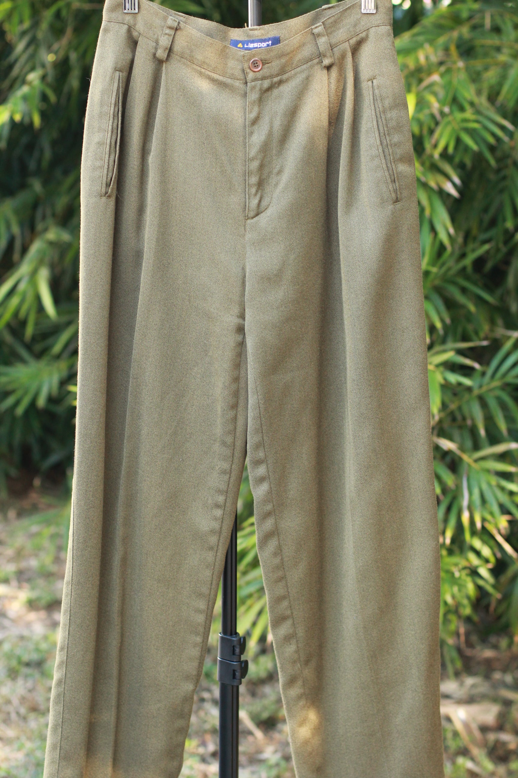Front view of retro tailored 90s trousers with side pockets