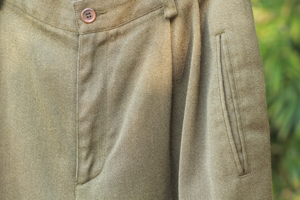 Vintage 1990s olive green high-waist trousers with cuffed hem