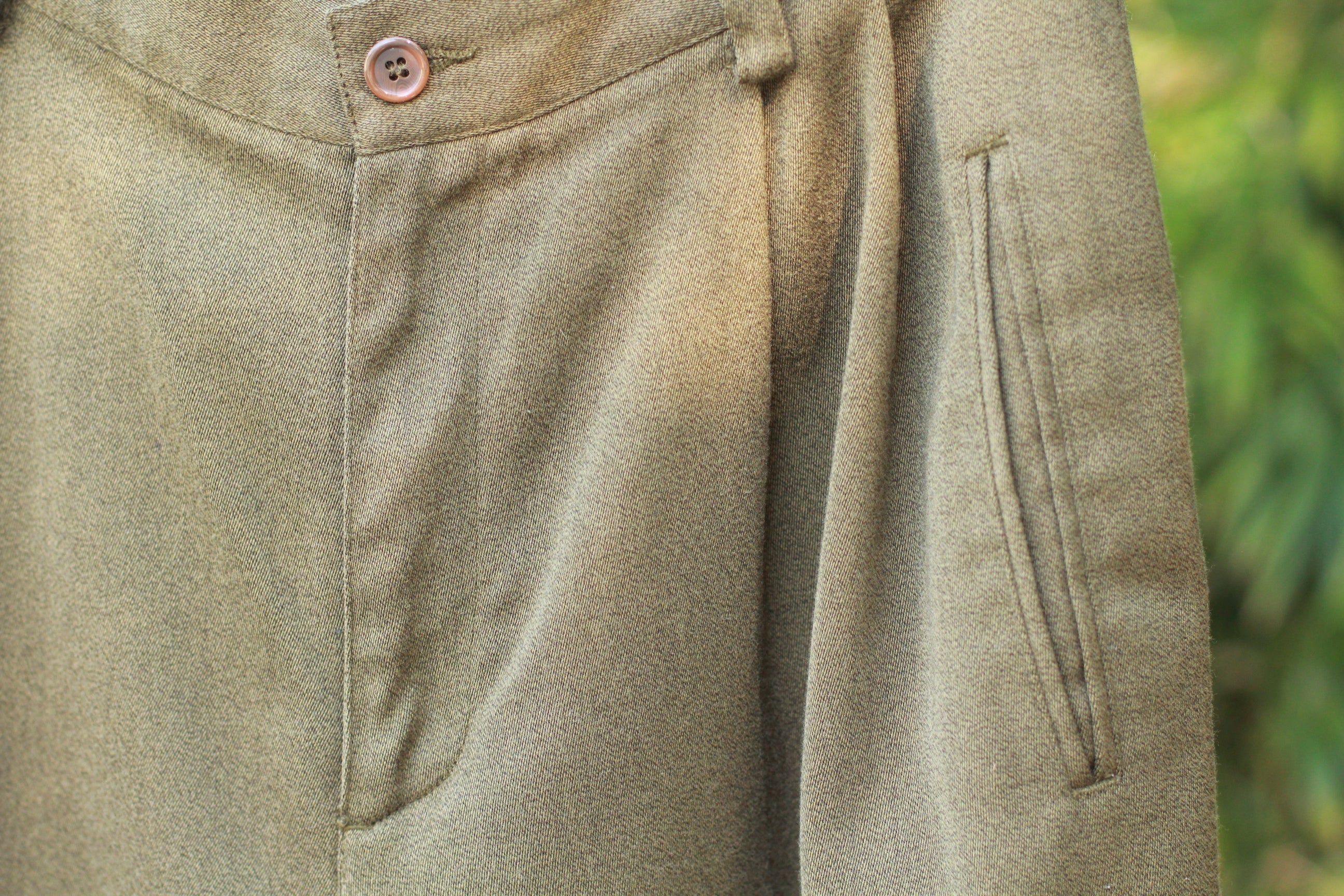 Vintage 1990s olive green high-waist trousers with cuffed hem