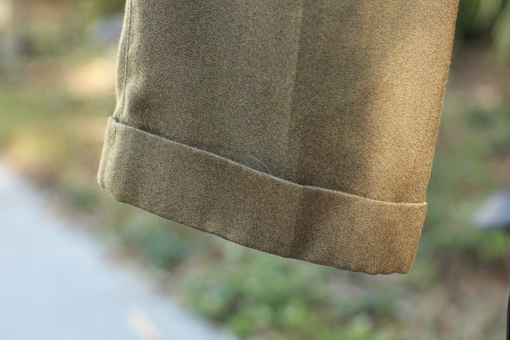 Close-up of cuffed hem detail on vintage pants