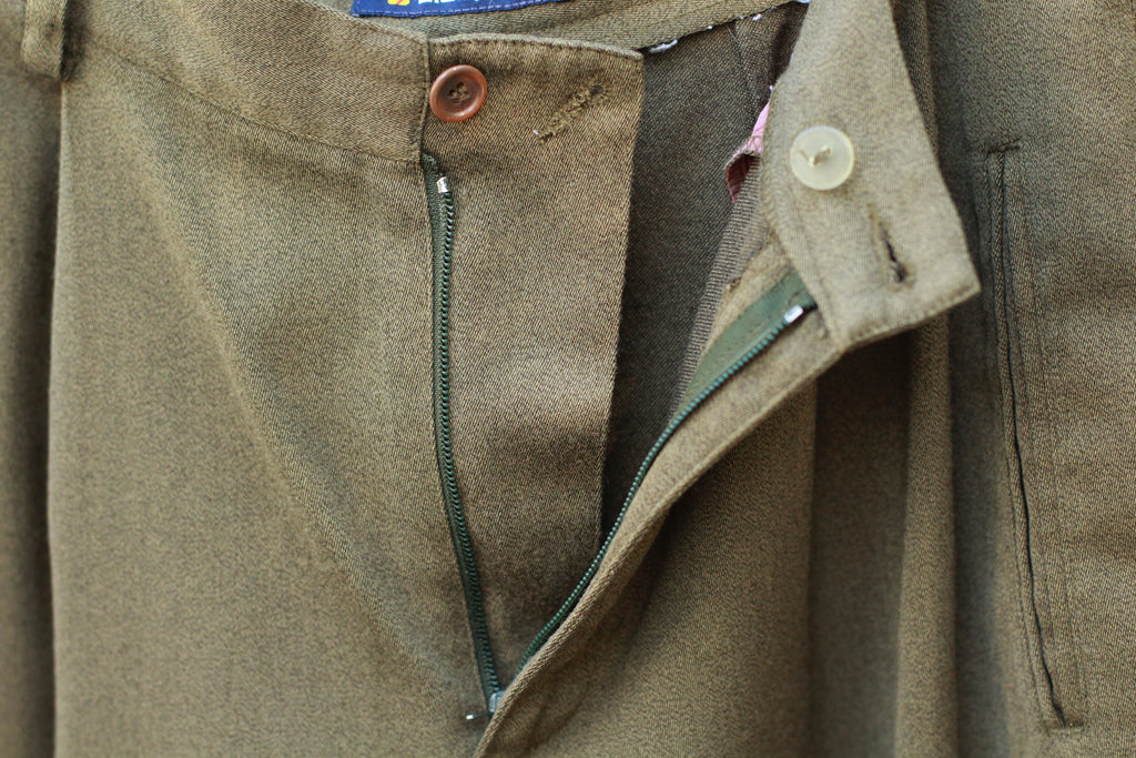 Close-up of unzipped fly detail on vintage pants