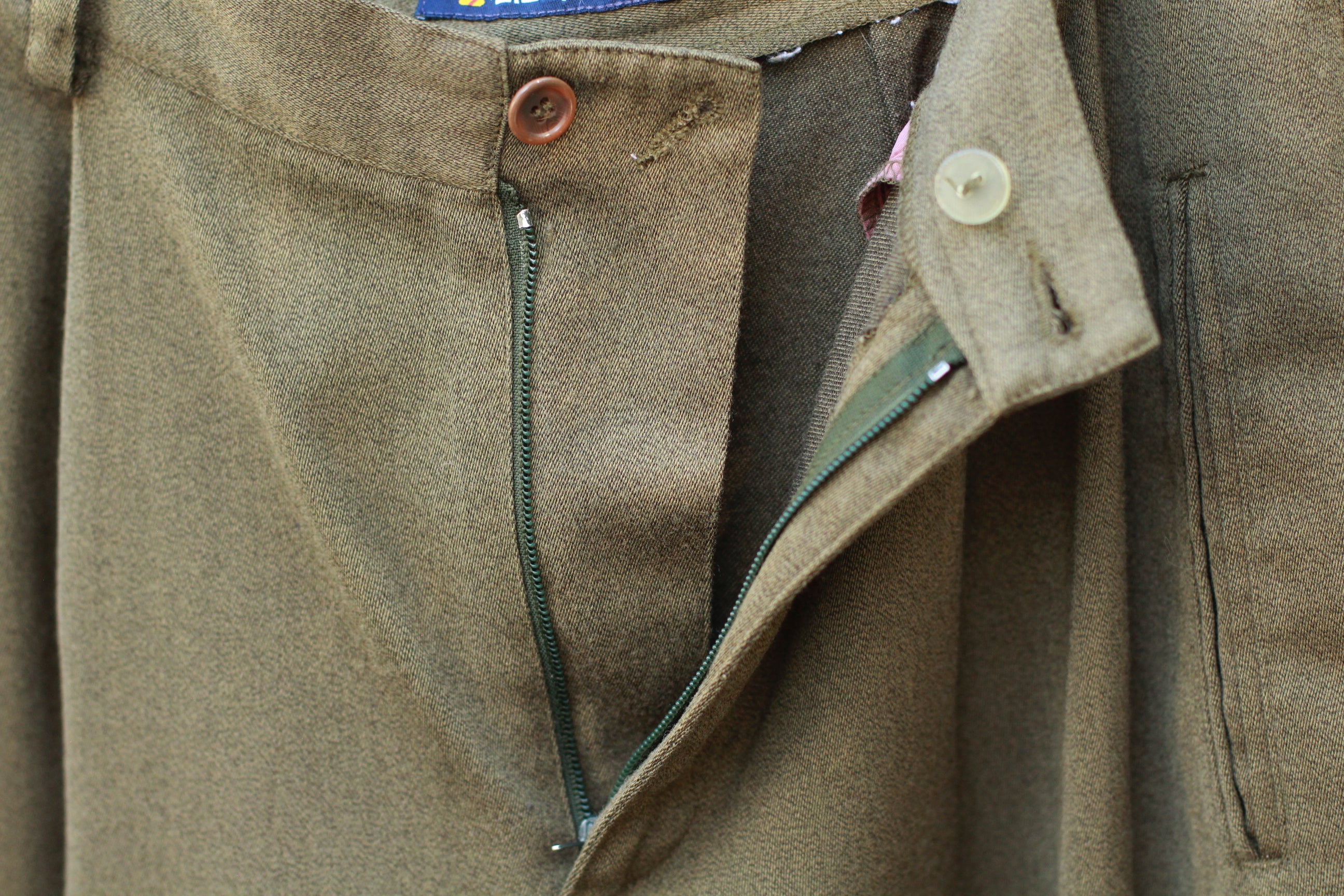 Close-up of unzipped fly detail on vintage pants