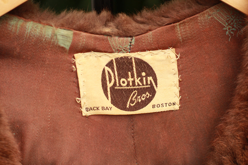Close up of Vintage 1940s Plotkin Bros mink stole tag