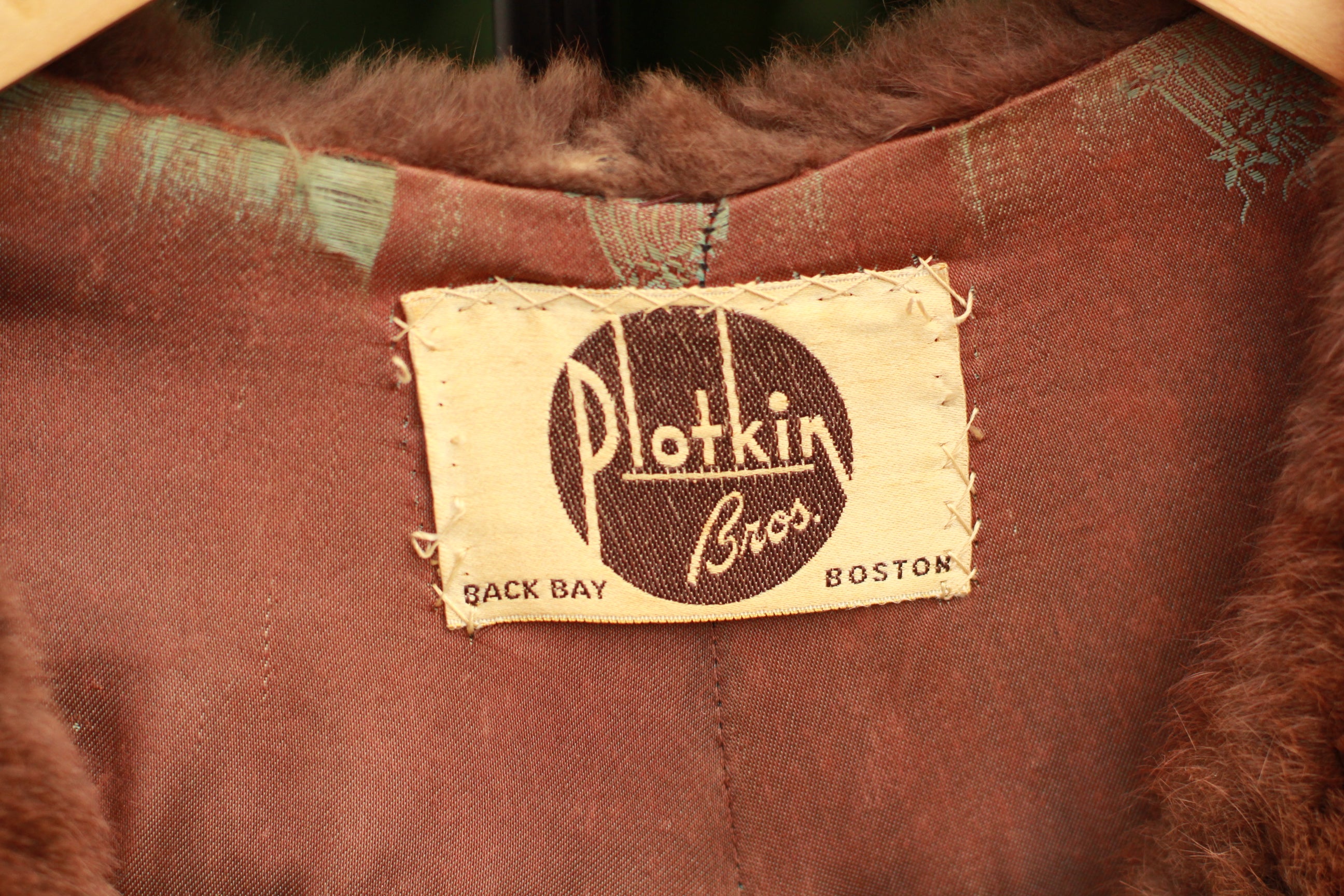 Close up of Vintage 1940s Plotkin Bros mink stole tag
