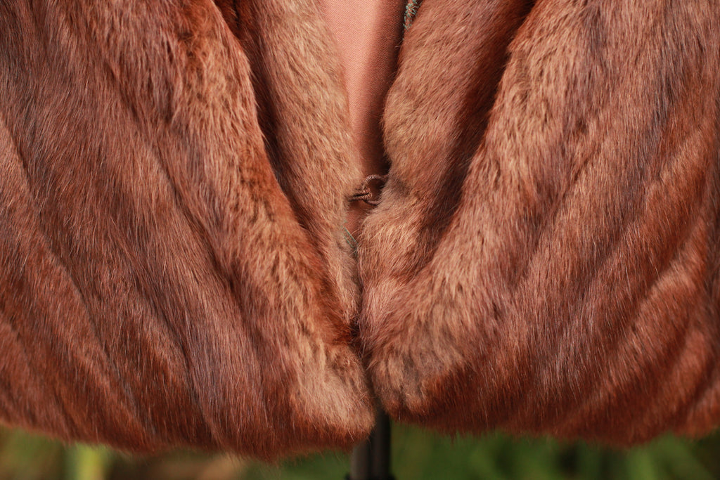 Close-up of luxury mink stole with hook-and-eye closure