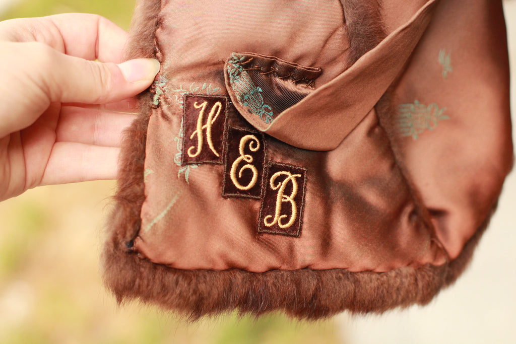Close-up of monogrammed interior and satin lining on vintage mink stole