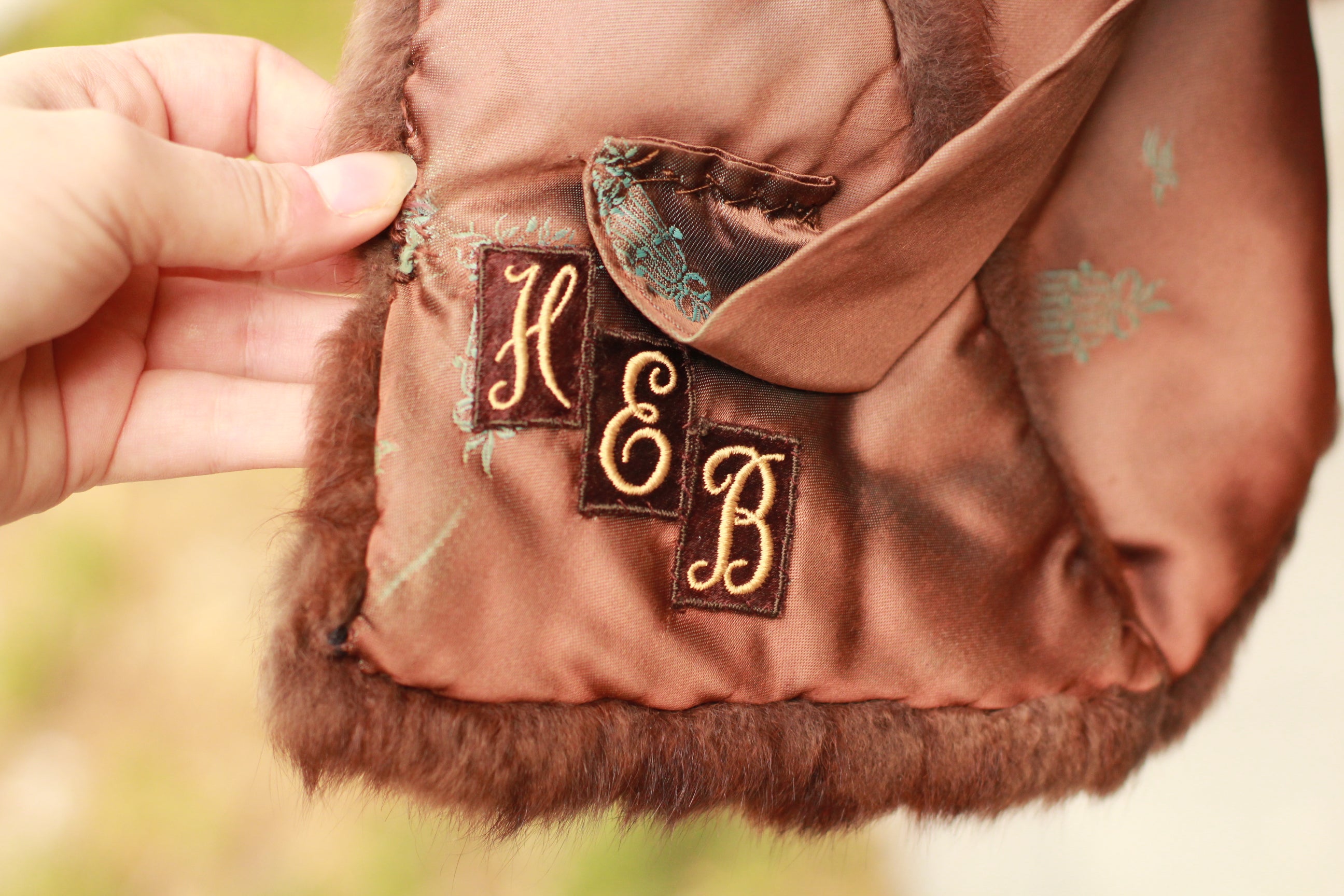 Close-up of monogrammed interior and satin lining on vintage mink stole