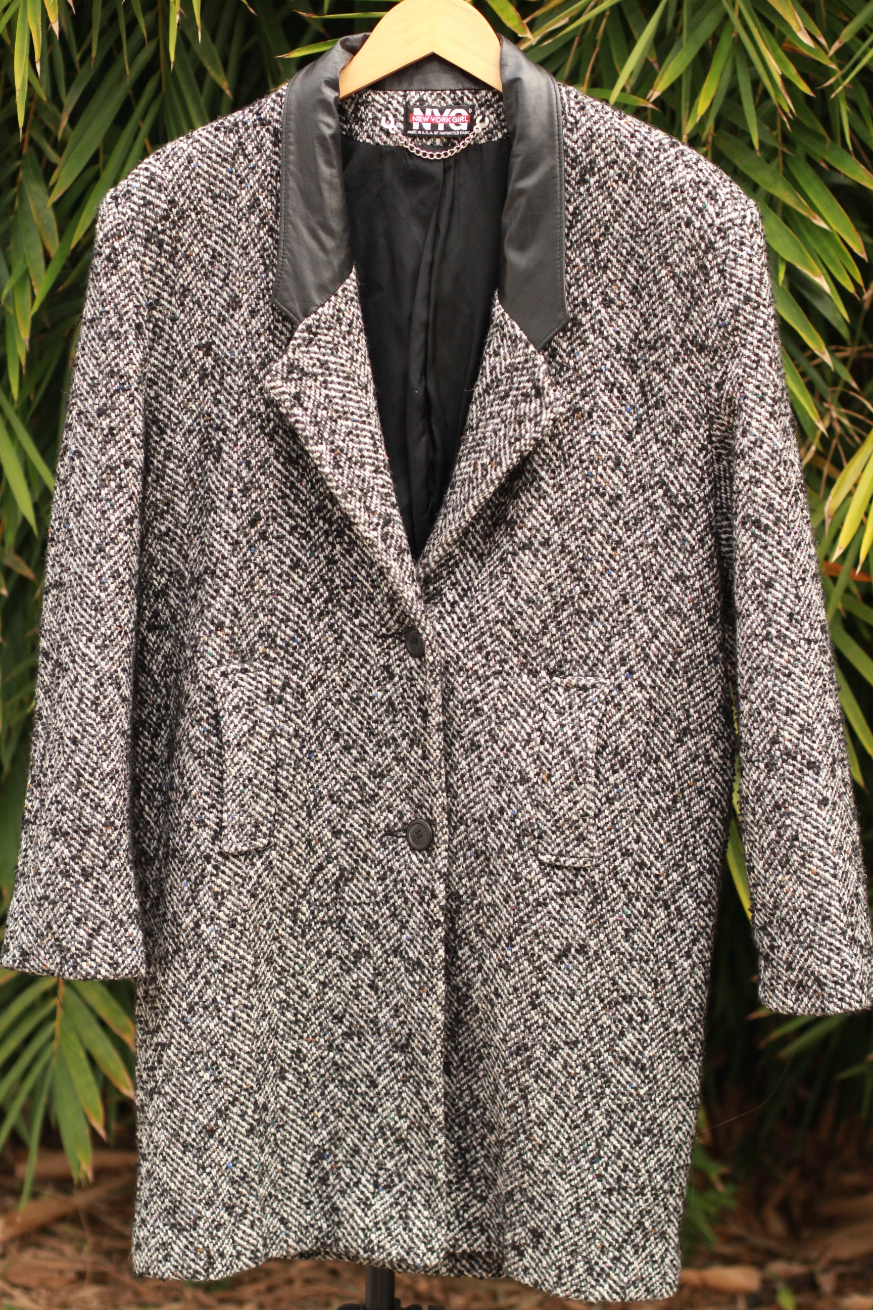 Vintage black and white herringbone tweed women’s coat with leather lapels, 1980s