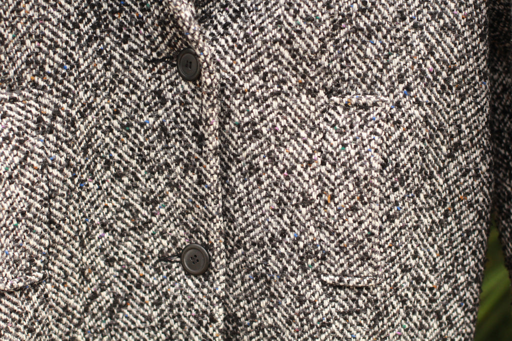 Close-up of black and white herringbone tweed on vintage women’s coat, Union Made USA