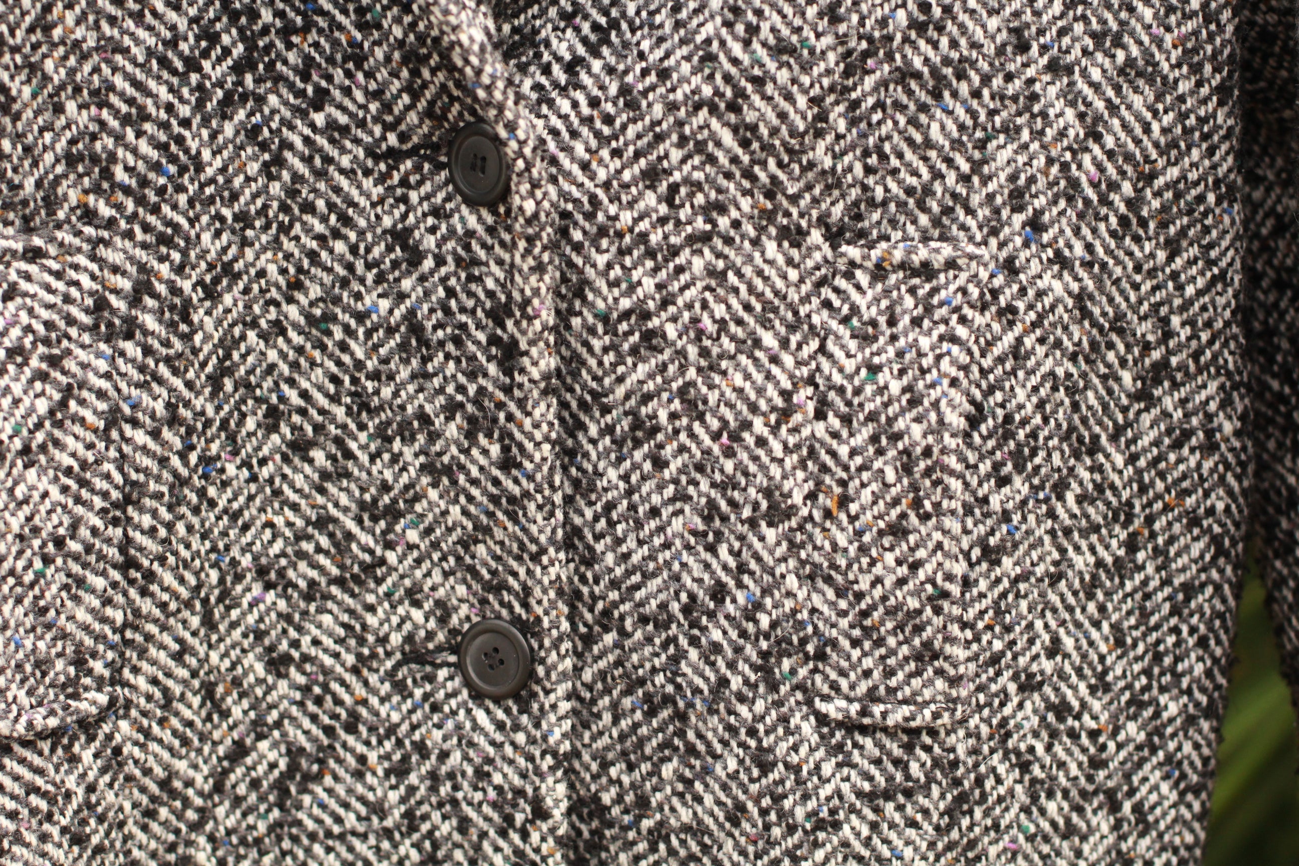 Close-up of black and white herringbone tweed on vintage women’s coat, Union Made USA