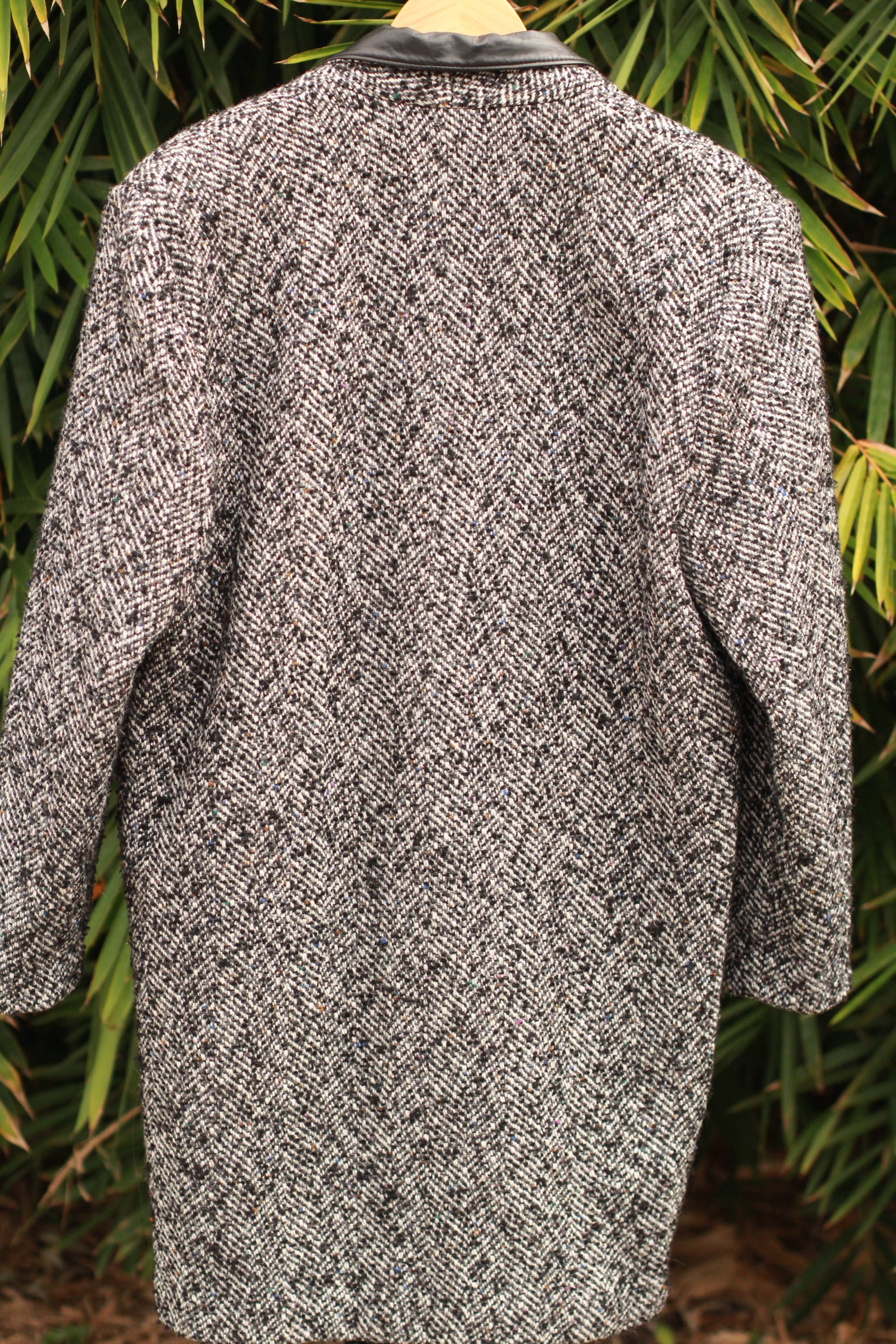 Back view of 1980s padded shoulder tweed coat women’s outerwear