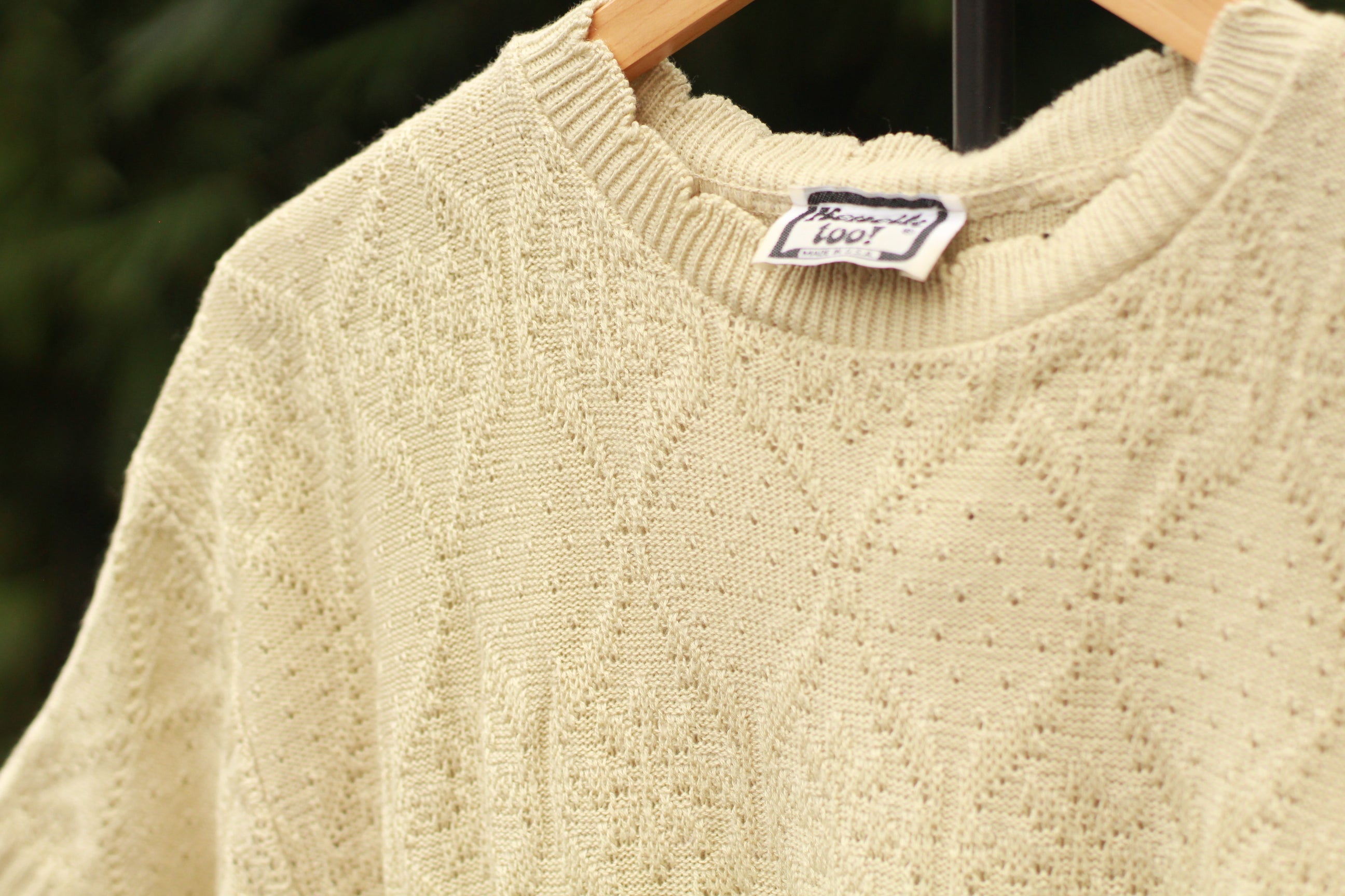 Close-up of scalloped neckline detail on 80s sweater