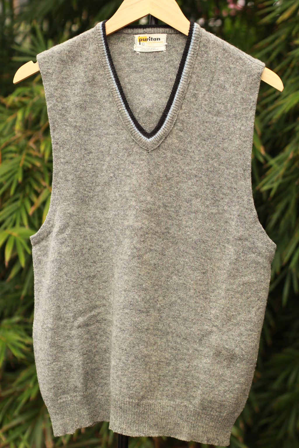 Front view of retro 60s gray sweater vest with V-neck trim