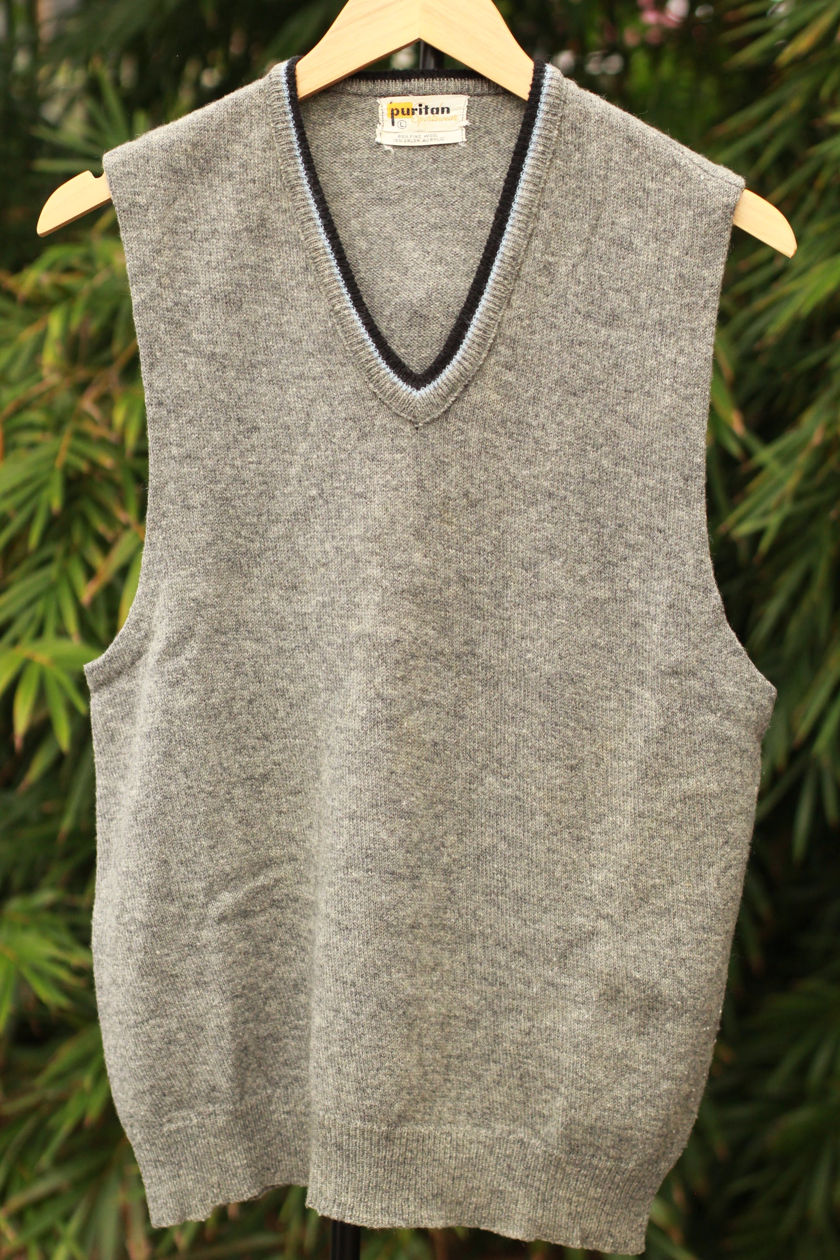 Front view of retro 60s gray sweater vest with V-neck trim