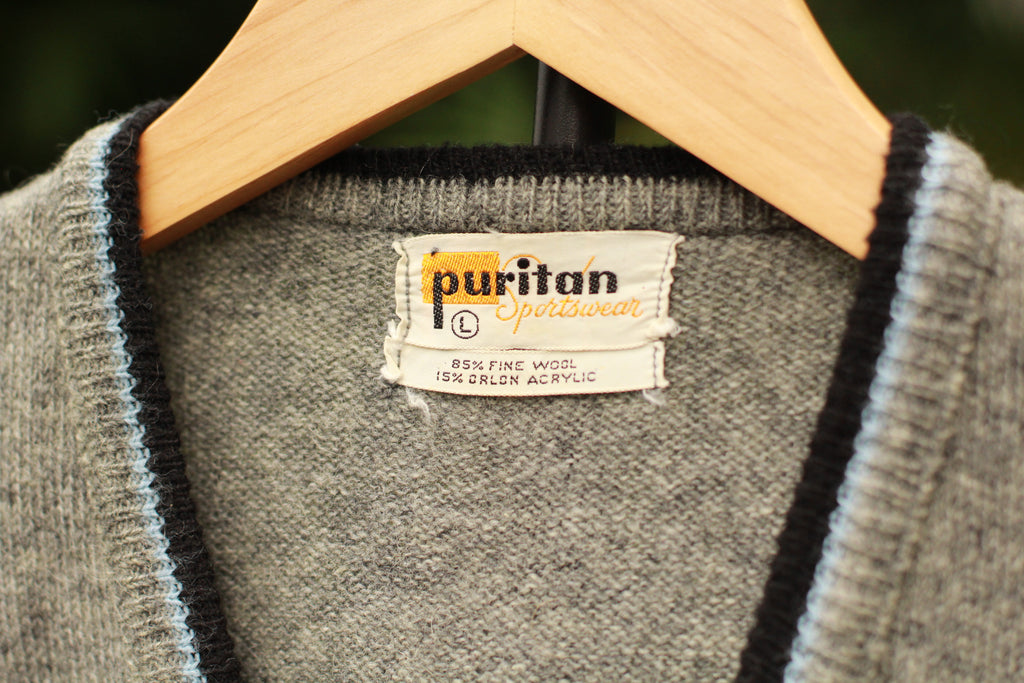 Vintage 1960s gray wool sweater vest with black and light blue V-neck trim