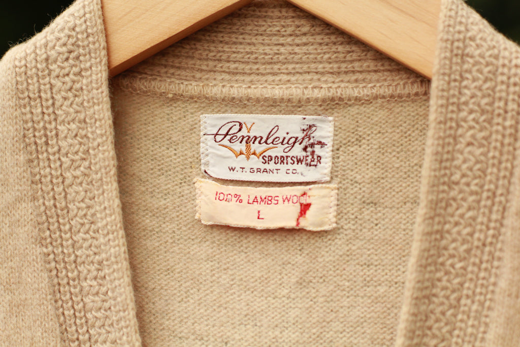 Close-up of knit texture and brand tag on vintage sweater vest