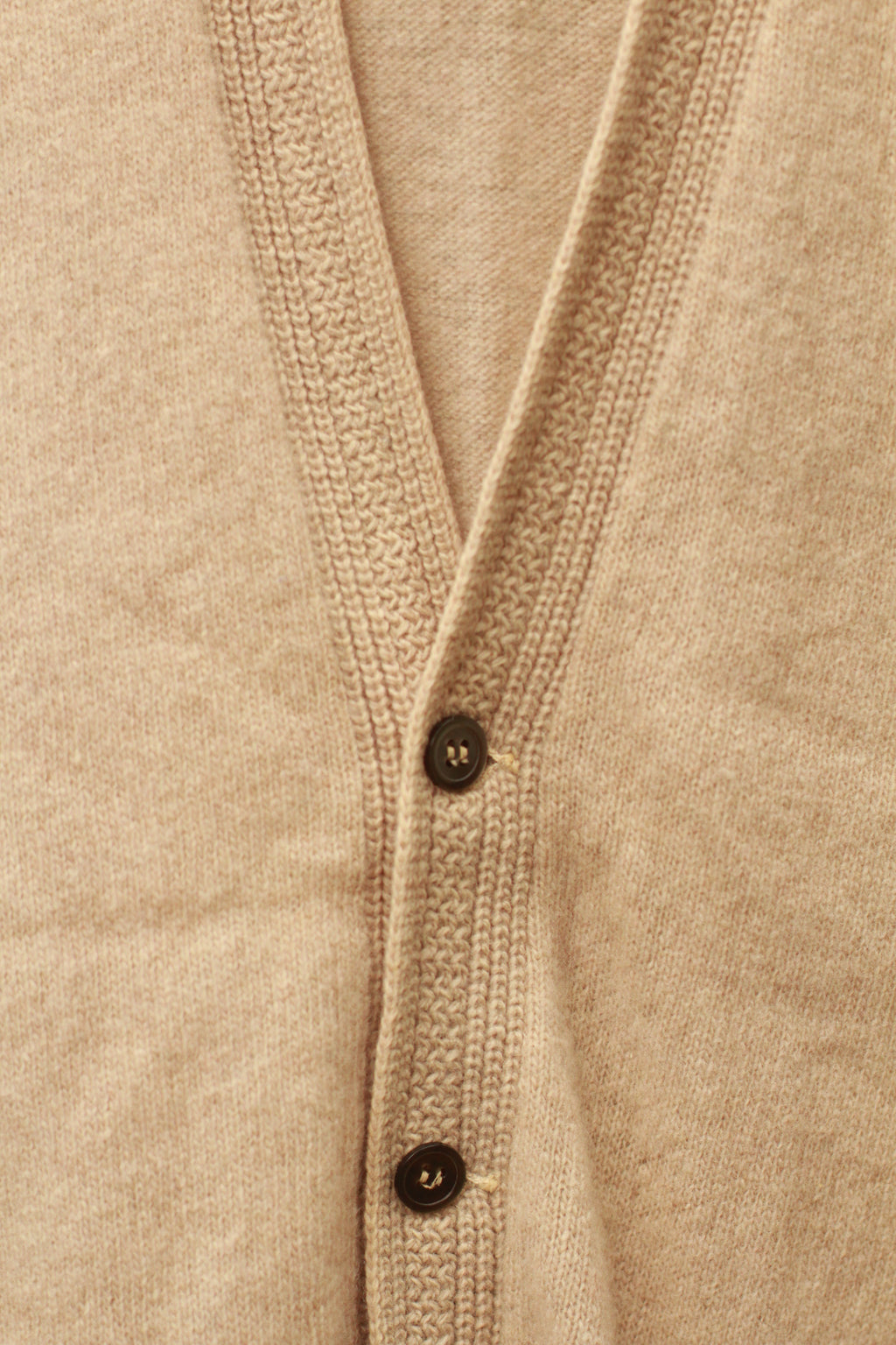 Vintage 1960s beige wool sweater vest with button-front closure and pockets
