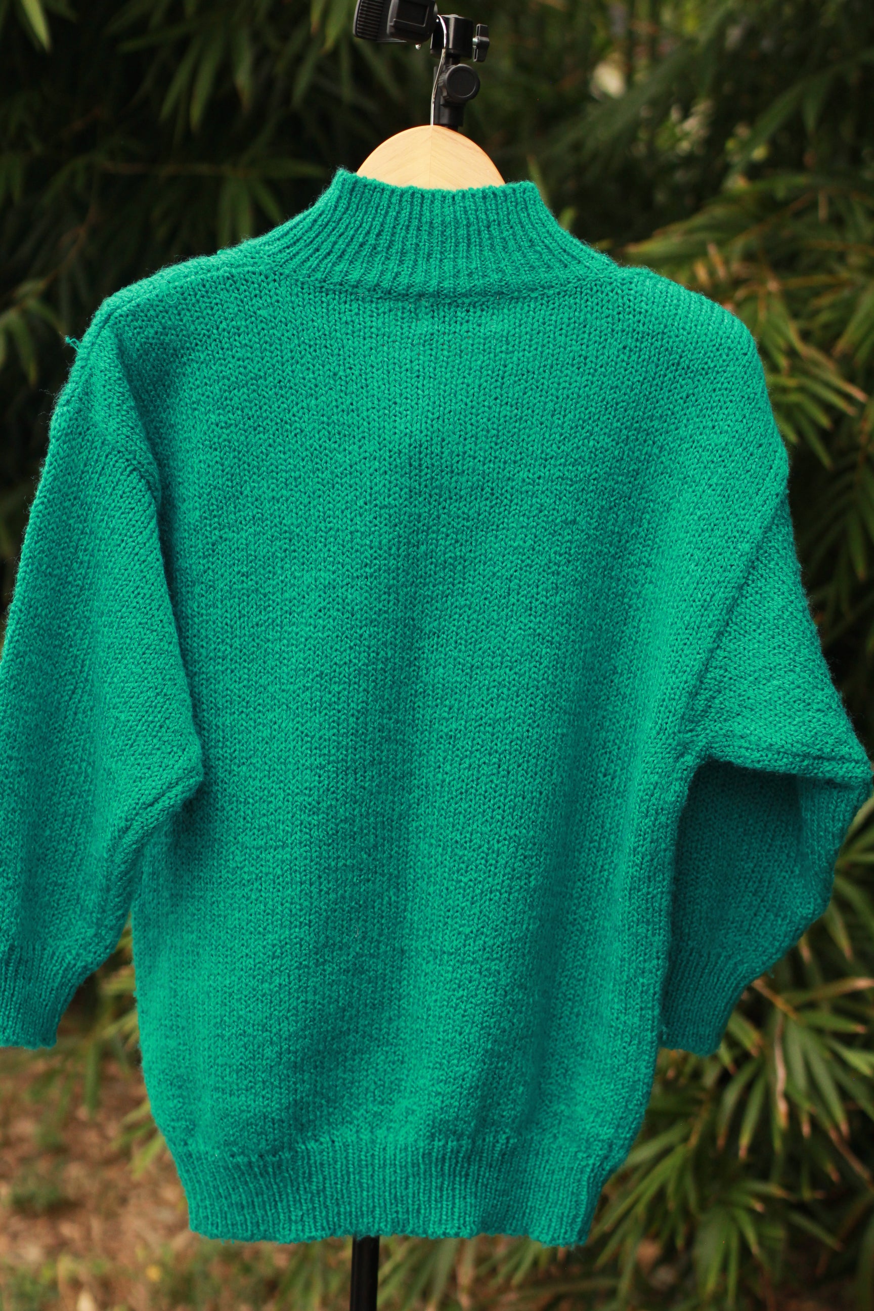 Back view of turquoise chunky knit pullover sweater