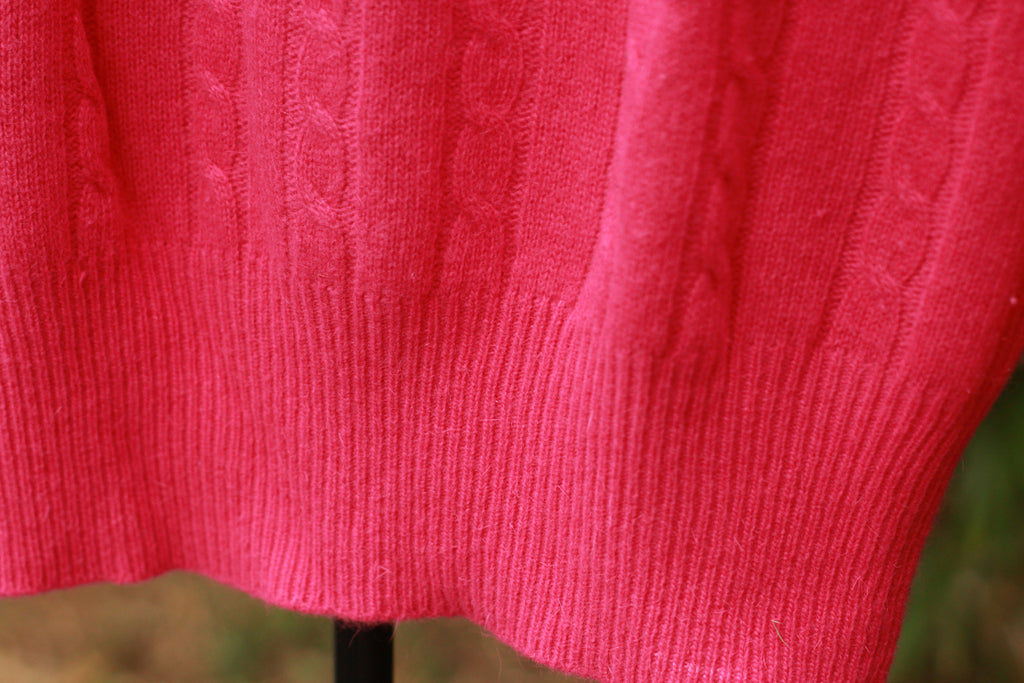 Close-up of cable knit texture and hem on vintage sweater