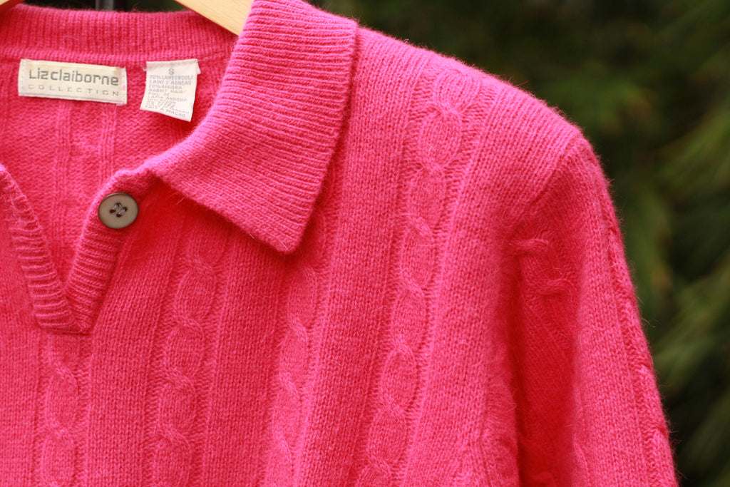 Close-up of cable knit texture and collar detail on vintage sweater