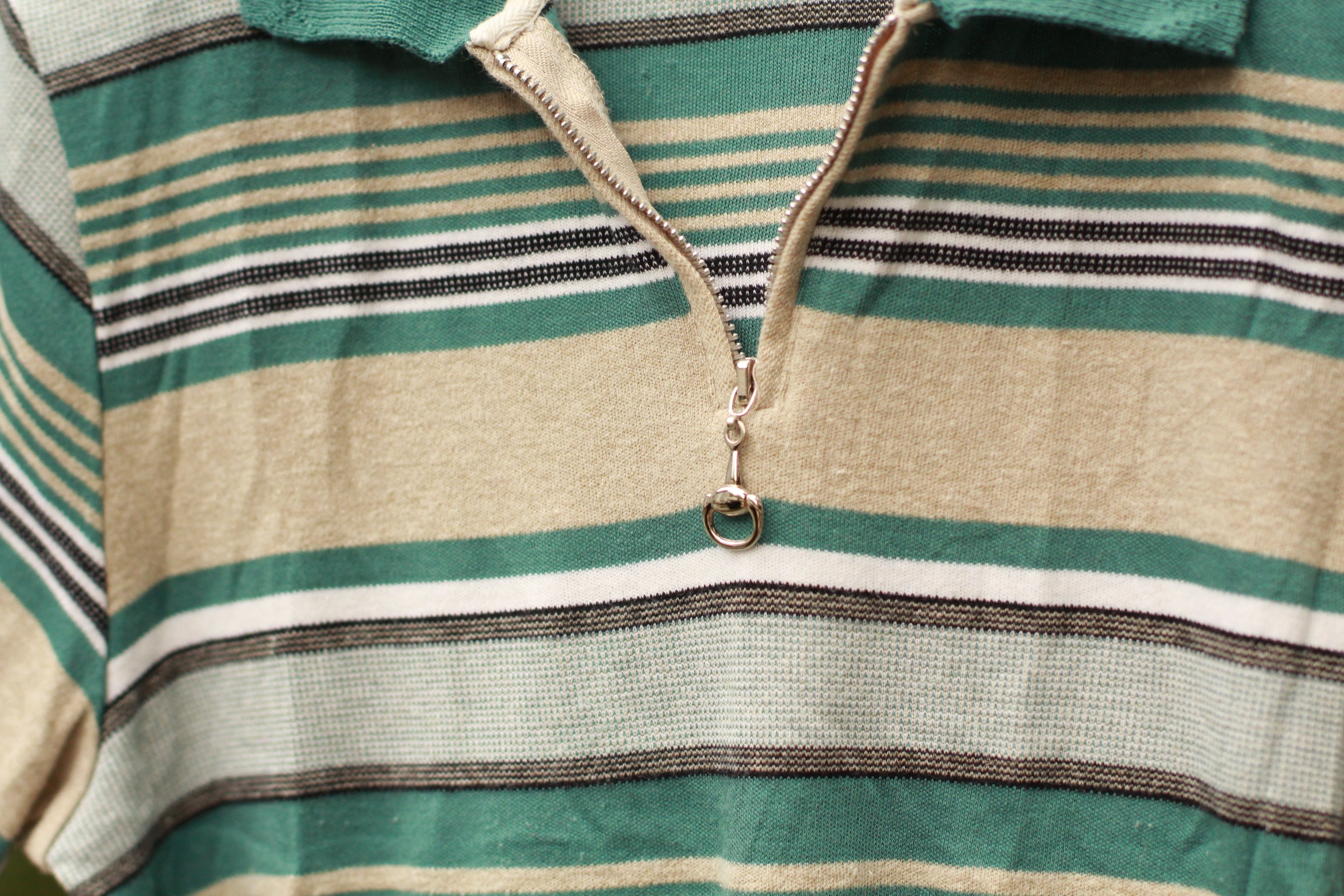 Front view of teal, white, and beige striped 80s knit sweater