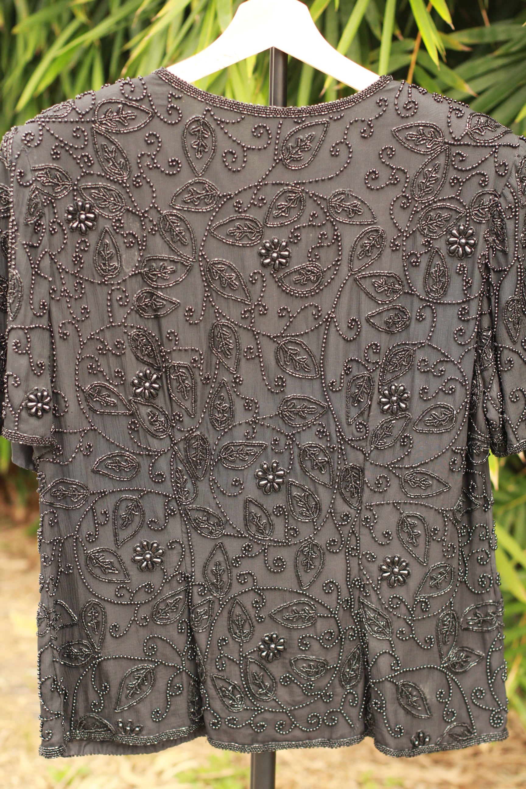 Back view of Stenay black silk evening jacket