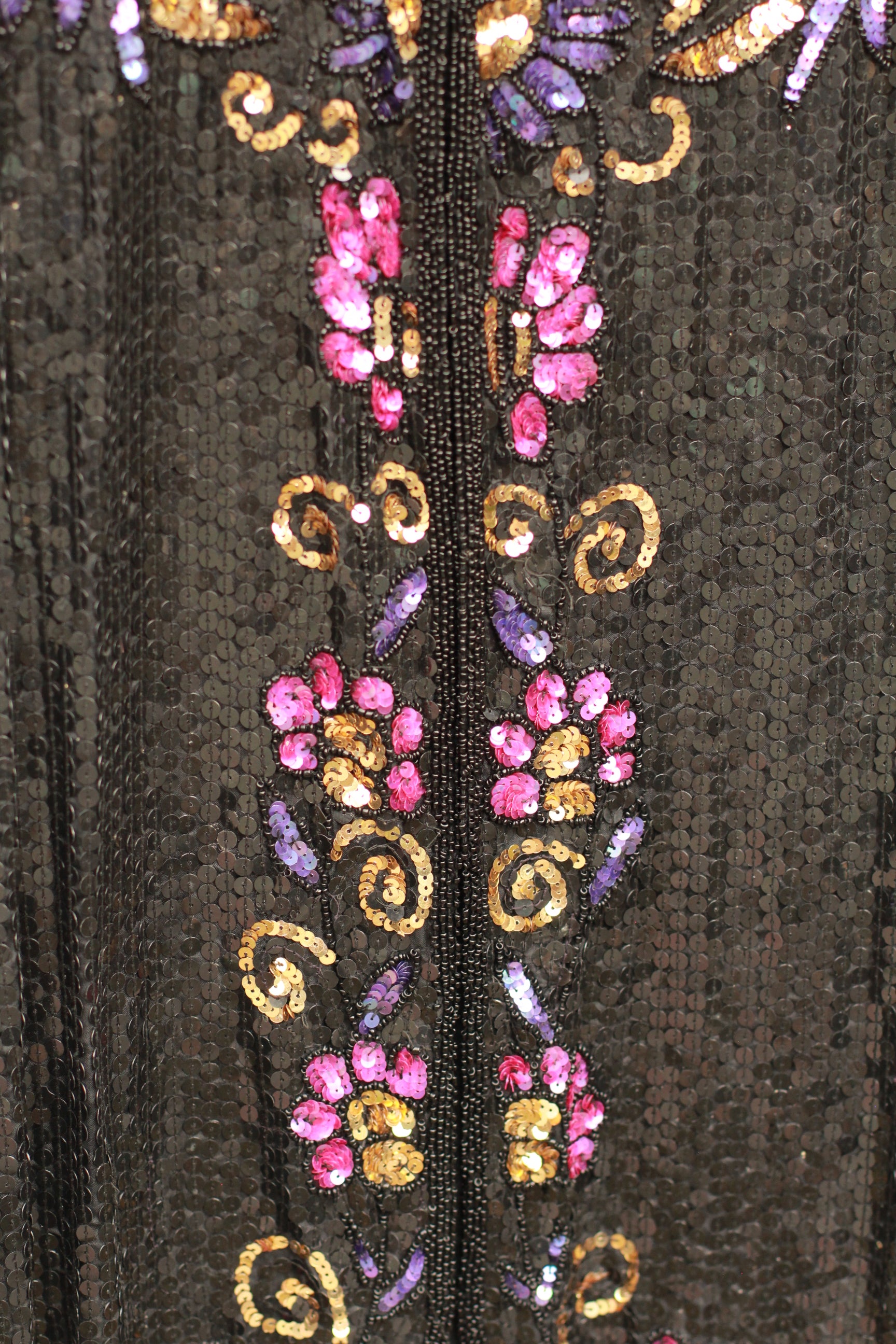 Pink, purple, and gold floral swirl sequins detail on silk jacket