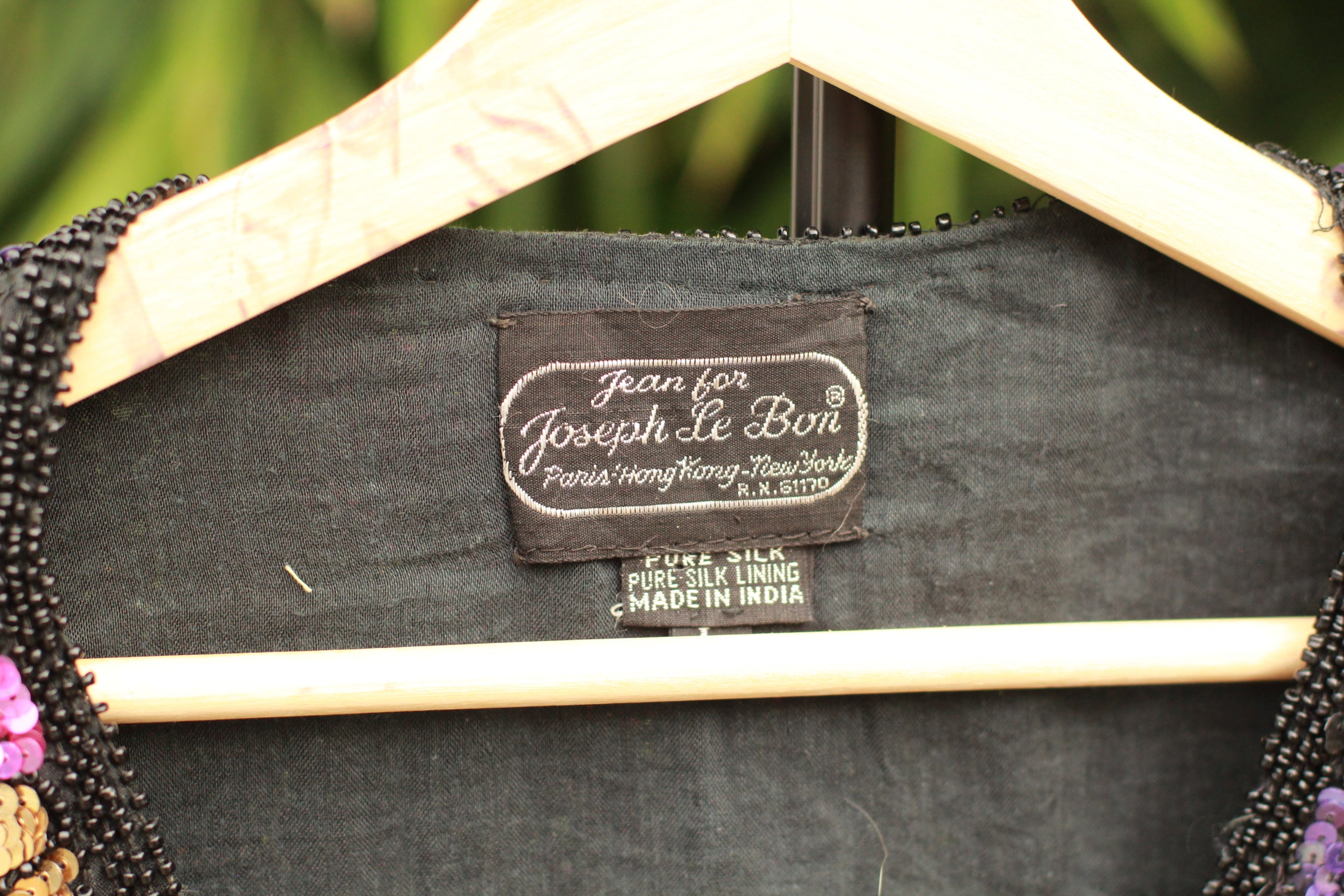 Close-up of garment tag for Vintage 1980s Jean for Joseph Le Bon black silk sequined cardigan jacket