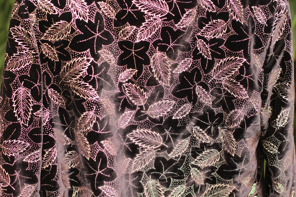 Close-up of glittery pattern and velvet texture on 1980s statement jacket